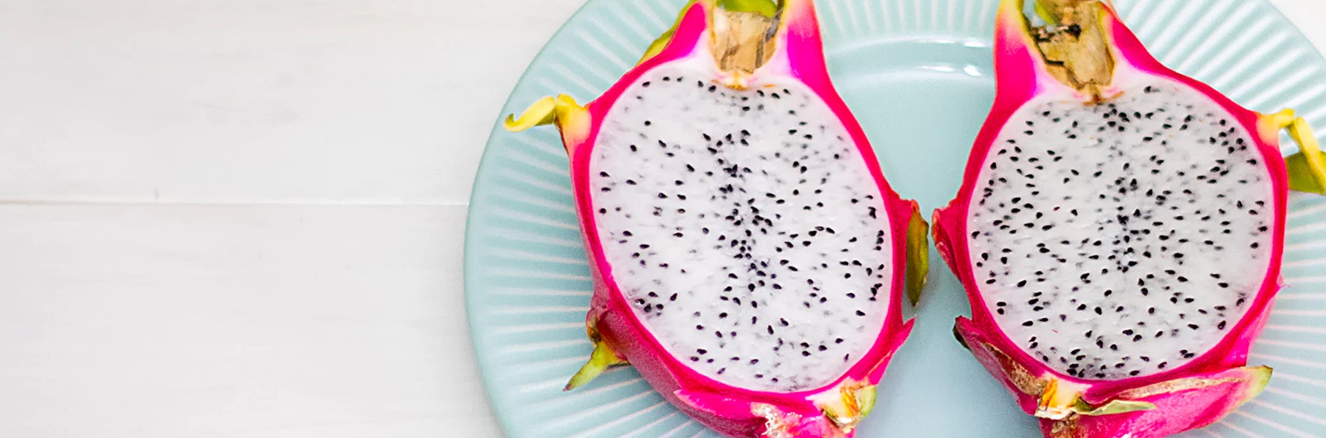 Dragon fruit sliced in half.